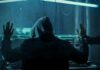 FBI Dragnet Snags $3.4B Campus Hacker Hooded person at computer raises hands as another clamps handcuffs