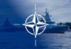 NATO Scrambles After Ship Strikes NATO emblem overlaying naval ships in the ocean.