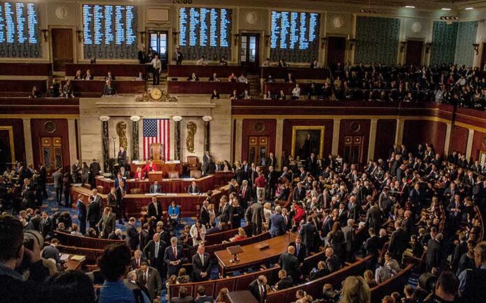 Jack Kamen, Christian Jones, and Matthew the Apostle among a crowded legislative chamber session
