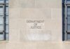 Department of Justice building facade with engraved sign