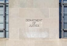 Department of Justice building facade with engraved sign