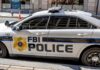 Unregistered China Operative Caught Pre-Flight FBI Police patrol car parked on city street
