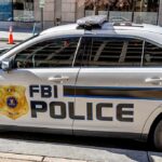 FBI Police patrol car parked on city street