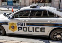 FBI Police patrol car parked on city street