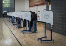 Glitchy Ballot Sparks Tennessee Uproar Voters at polling booths in a gymnasium
