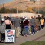 Inside Vance’s Raucous Florida Midterm Rally voters standing in a long line outside a polling place