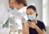 Body Brokers Target Homeless – Insurers Bleed Healthcare worker giving a masked patient a vaccine in the upper arm