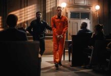 Probation After Face Shooting Sparks Fury Defendant in orange jumpsuit escorted by officer in courtroom